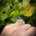 18CT YELLOW GOLD SUGARLOAF TANZANITE, EMERALD & DIAMOND RING
